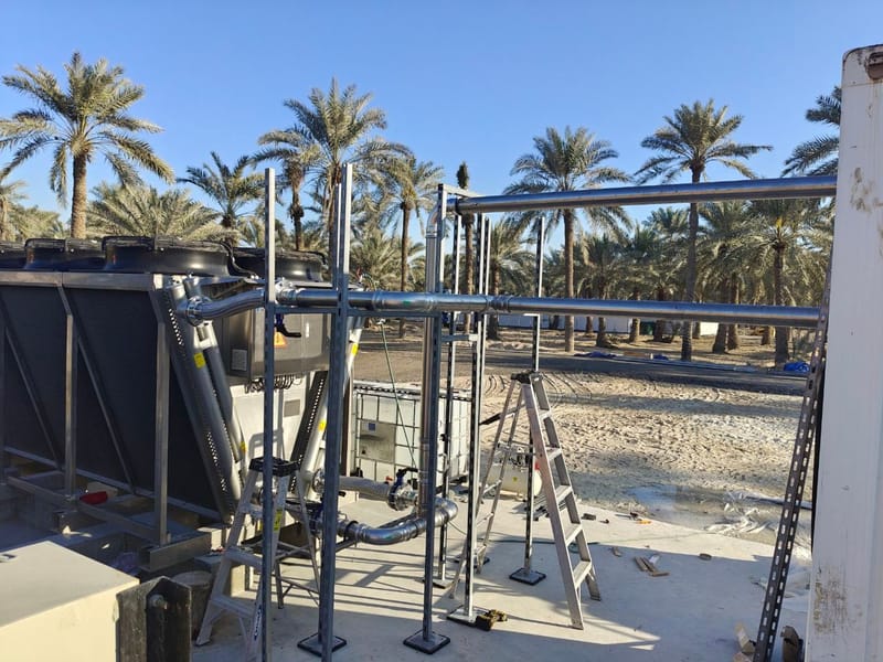 Engineers commissioning a container installation in Bahrain
